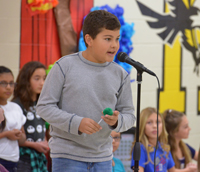 student at microphone