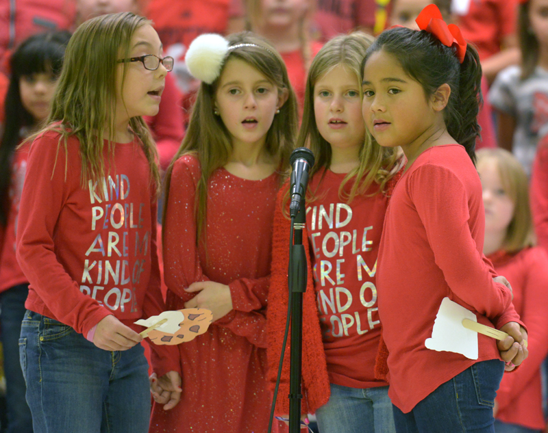 students singing at microphone