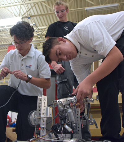 two students working on robot