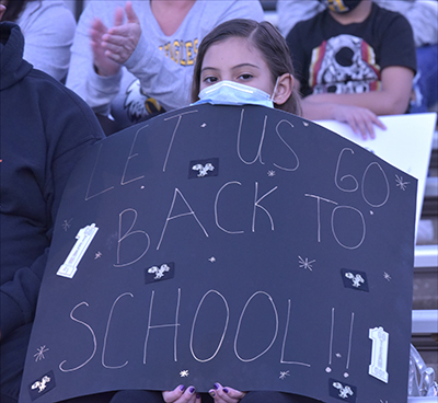 student holding sign